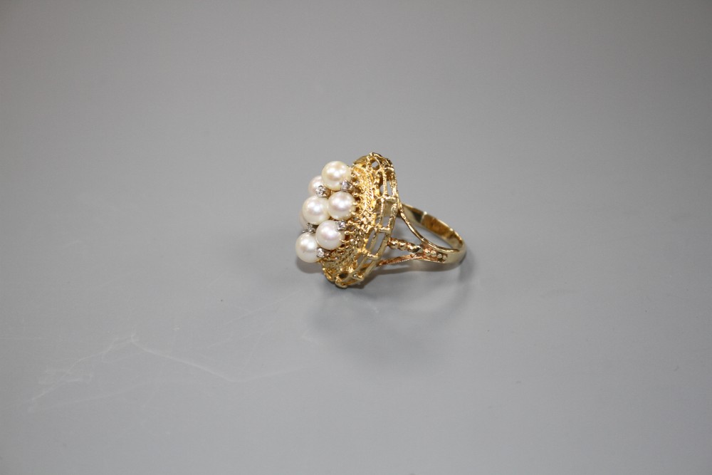 A modern 14k yellow metal, cultured pear and diamond cluster set oval dress ring, size P, gross weight 9.2 grams.